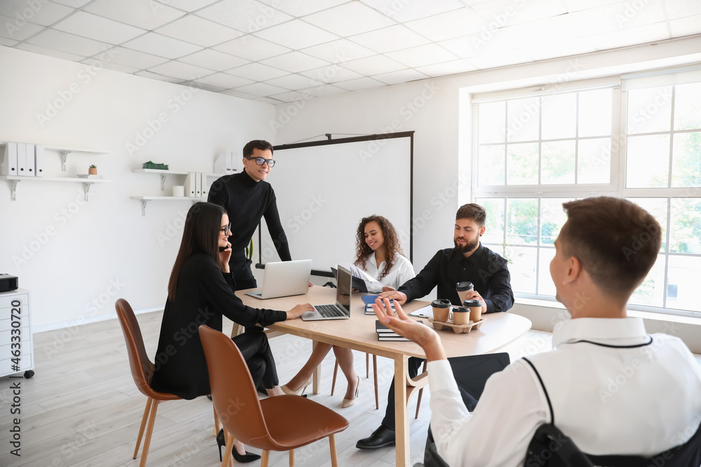 Young business colleagues working on presentation in office