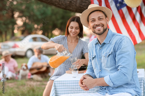 Happy couple at barbecue party on summer day