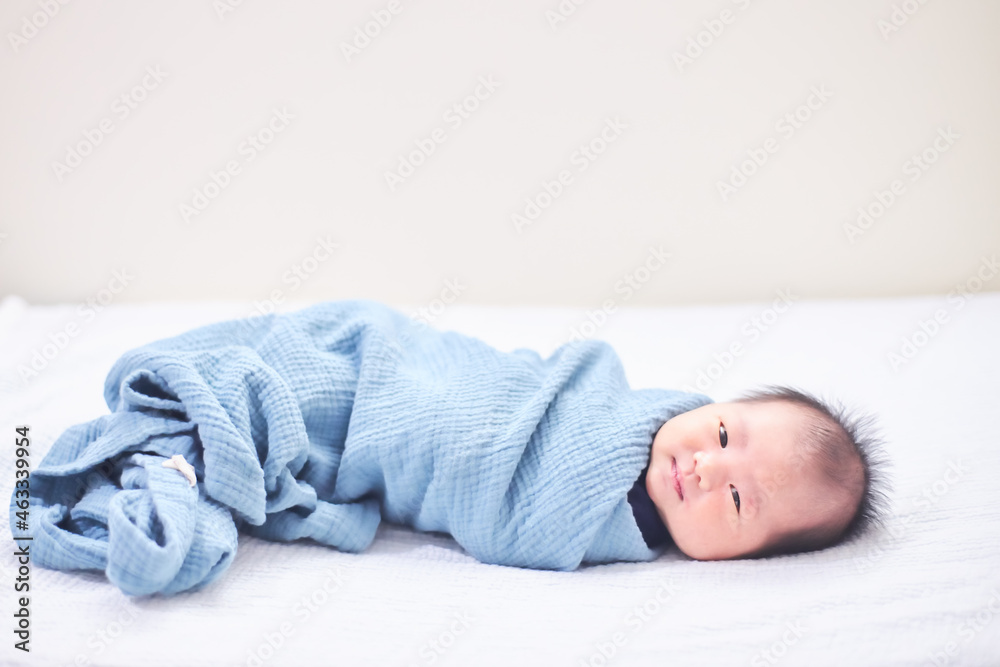 Child is laying in bed with smiling face Child is laying in bed with smiling face
