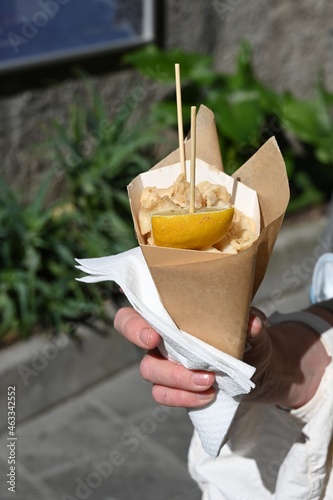 Cartoccetto con totani fritti venduti da una frigitoria nel centro storico di Manarola photo