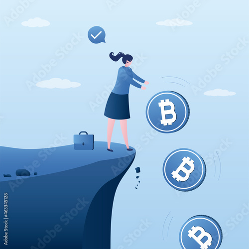 Female investor or trader standing on cliff and drops bitcoins. Frustrated investor gets rid of Bitcoin. Financial losses from investments in crypto.