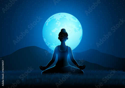 Beautiful woman doing yoga on a full moon background