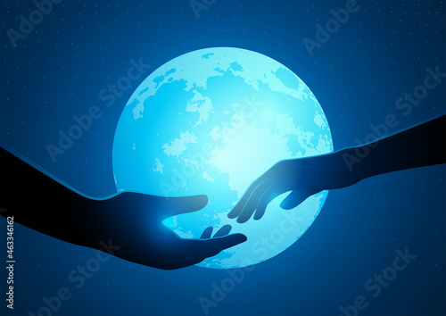 Couple hands reaching to one another on a full moon background
