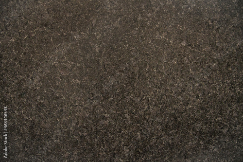 The texture of black granite with a pink tint for external use. Close-up