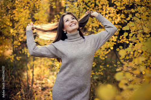Autumn portrait of happy lovely and beautiful young woman wiht long hair.