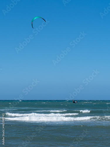 Kitesurfing During a Windy Day with a Very Rough Sea