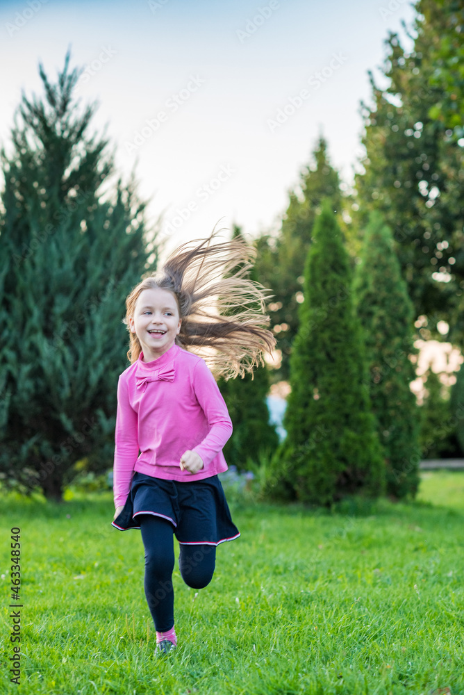 Beautiful little girl is playing in the park. Beautiful little girl is playing in the park.