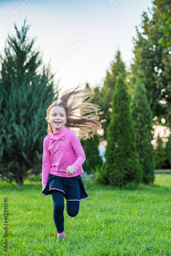 Beautiful little girl is playing in the park. © shymar27