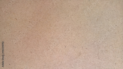fiberboard, background texture of recycled wood, fiberboard in light beige and brown colors, texture of old paper or wood panels in a vintage retro style