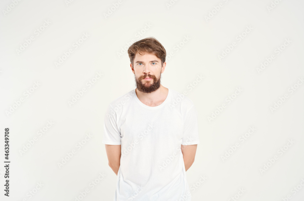 Obraz premium handsome bearded man in white t-shirt fashion studio