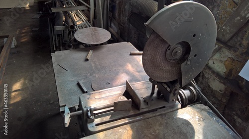 Workshop of the master of metal. Circular saw in the garage on the work table of a carpenter