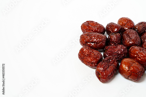 Dried Chinese dates isolated on white background. Close up of dried Chinese red dates or jujube.