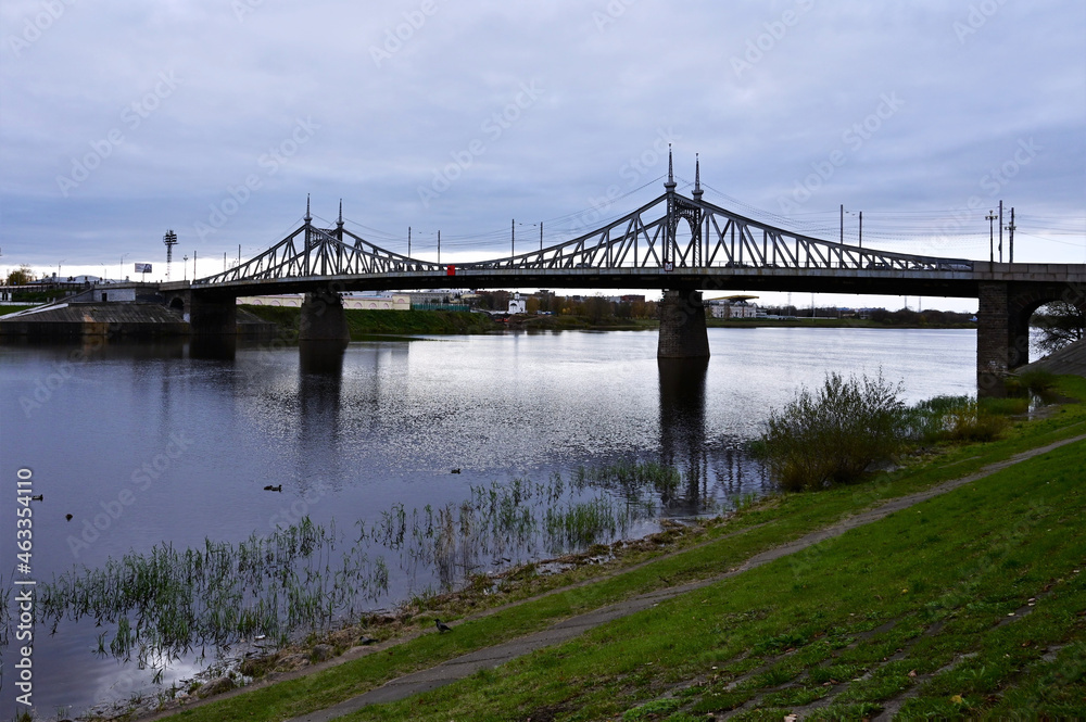 Naklejka premium Urban landscape with Starovolzhsky Bridge over Volga River in Tver. Concept of architecture of small city. Tver, Russia