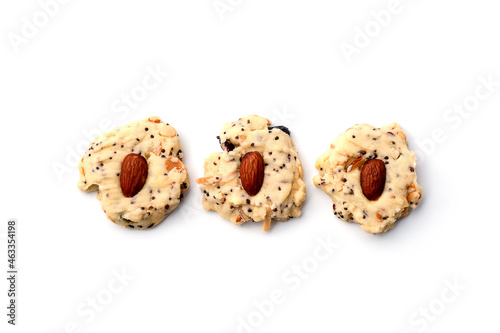 Three different whole grain almond cookies, isolated on white background.