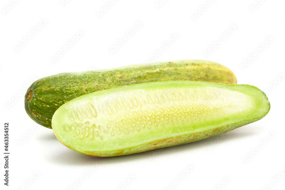 Macro close-up of Organic fresh green half piece Slice of cucumber (Cucumis sativus) with seeds isolated over white background Macro close-up of Organic fresh green half piece Slice of cucumber (Cucumis sativus) with seeds isolated over white background