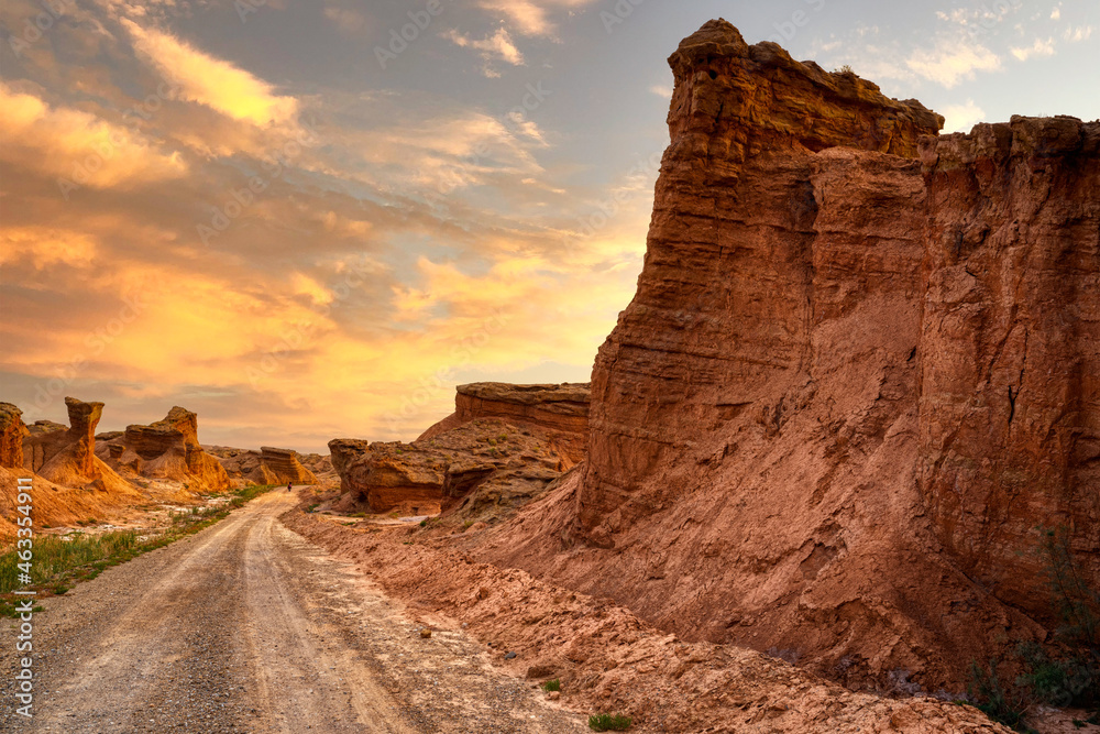 long road in sandstone mountains in Xinjiang, China
