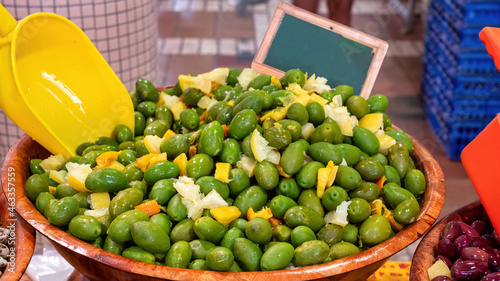 Olives with lemon at a market in Cannes, France photo