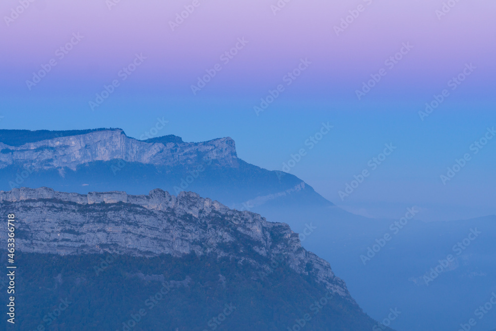 mountains in the fog and colorful sky