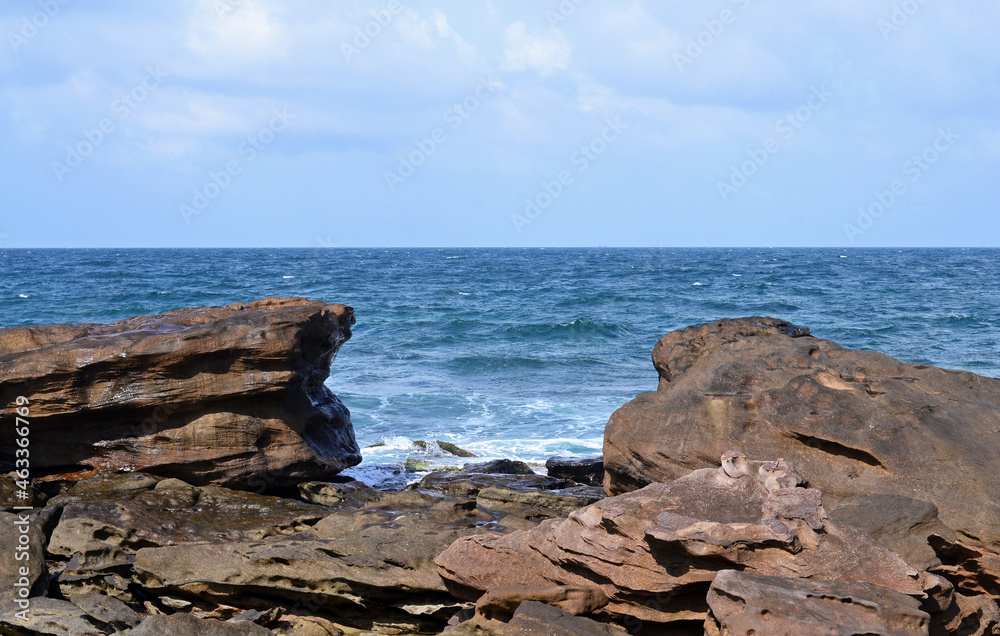 View from the rocky coast to the turquoise sea