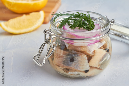 salted fillet of herring in a glass jar