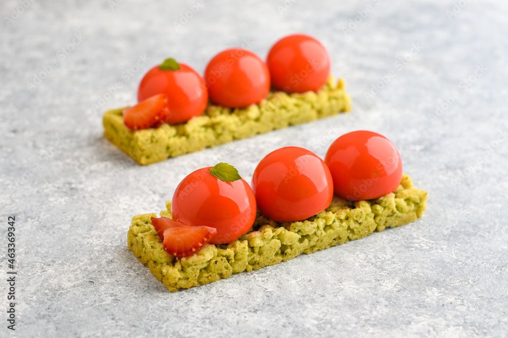 Strawberry sablée dessert with fresh berry, nuts and mouse filling