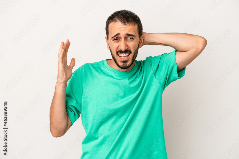 Young caucasian man isolated on white background screaming with rage. Young caucasian man isolated on white background screaming with rage.