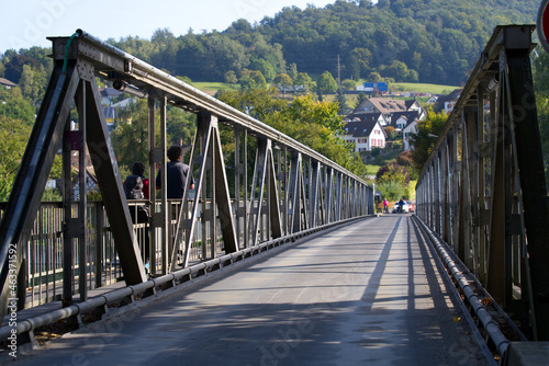 Iron bridge over River Rhine connecting Neuhausen am Rheinfall with Flurlingen on a beautiful autumn day. Photo taken September 25th, 2021, Zürich, Switzerland.