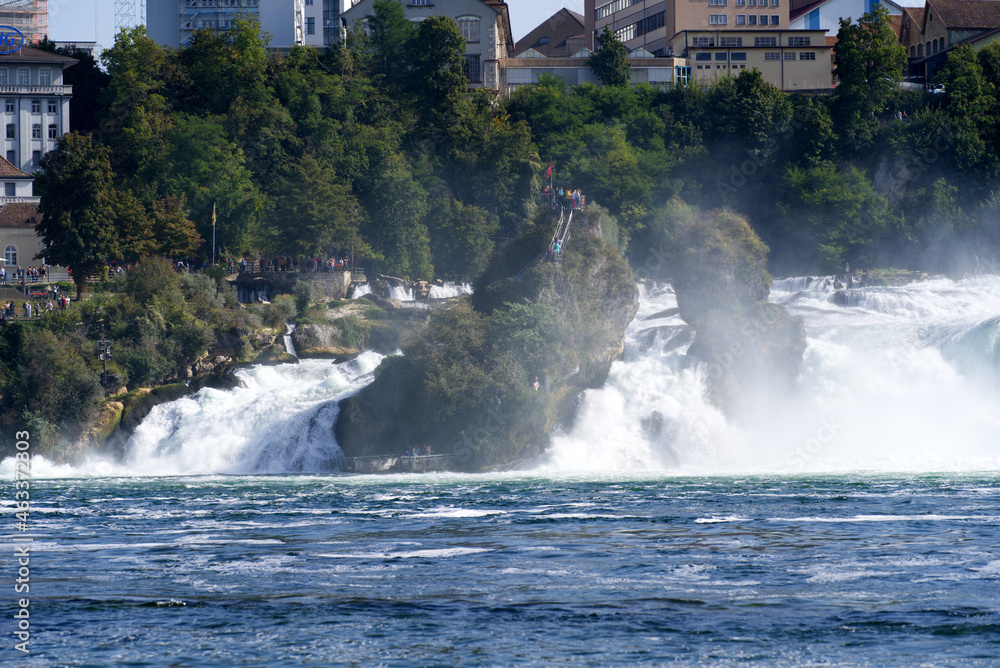 Fototapeta premium Famous Rhine Falls with rocks and trees on a beautiful autumn day. Photo taken September 25th, 2021, Zürich, Switzerland.