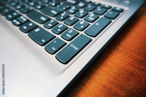 Modern laptop keyboard close up