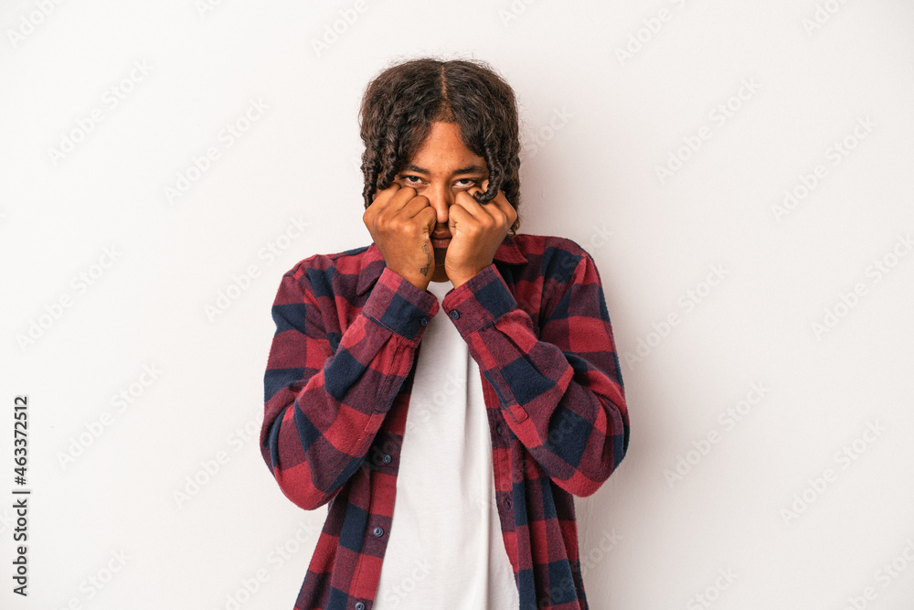 Young african american man isolated on white background throwing a punch, anger, fighting due to an argument, boxing. Young african american man isolated on white background throwing a punch, anger, fighting due to an argument, boxing.