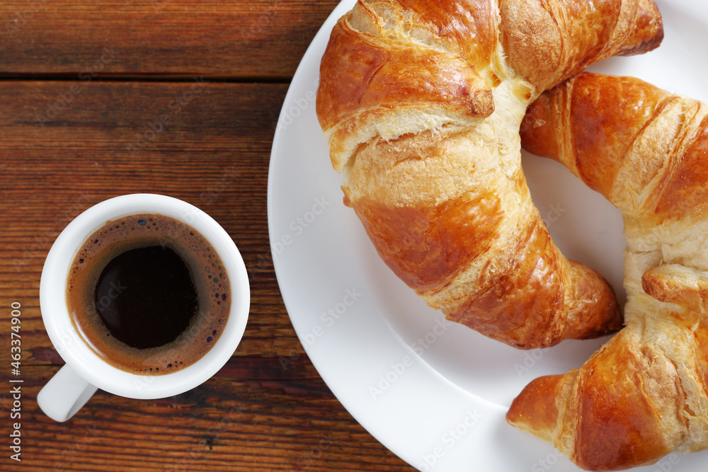 Two croissants and coffee Two croissants and coffee