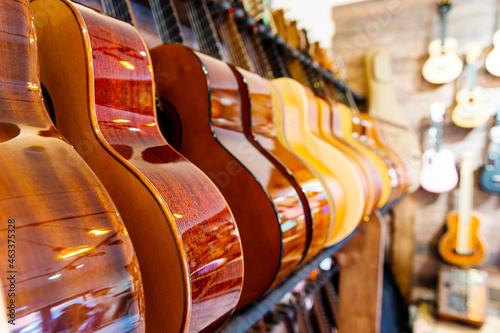 A number of classic acoustic guitars in the music store.