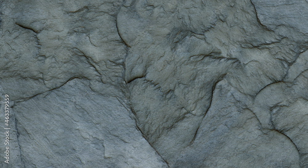 Fototapeta premium The texture of the stone wall. Close-up. Light gray rock backdrop.