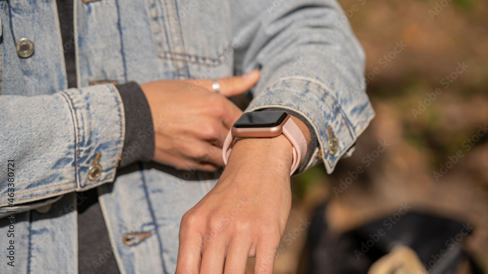 Woman hands in smart watch walking outdoors, step counting, fitness tracker, close up, copy space Woman hands in smart watch walking outdoors, step counting, fitness tracker, close up, copy space