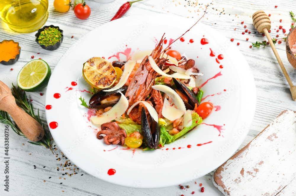 Frutti di mare salad with seafood: shrimp, squid, mussels and octopus. Top view. Rustic style. Frutti di mare salad with seafood: shrimp, squid, mussels and octopus. Top view. Rustic style.