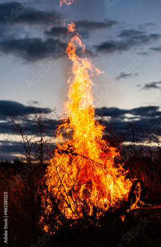 big bonfire burning in the dark against the sky