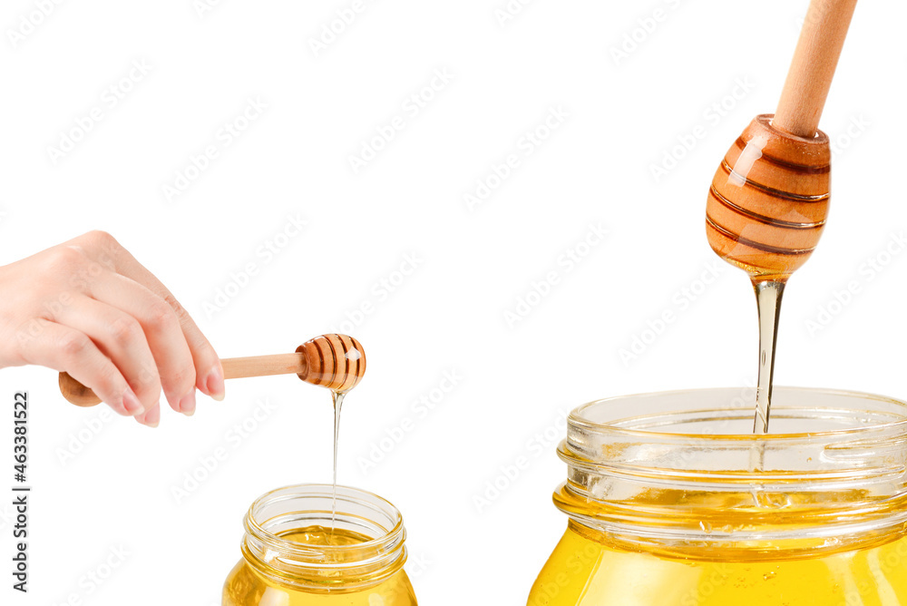 Dipper with honey in woman hand. Space for text or design. Dipper with honey in woman hand. Space for text or design.