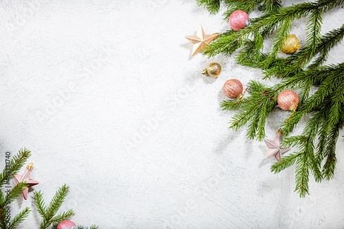 White winter holiday background with green branches decorations copy space