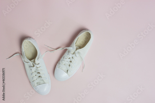 White shoes on a pink background. 