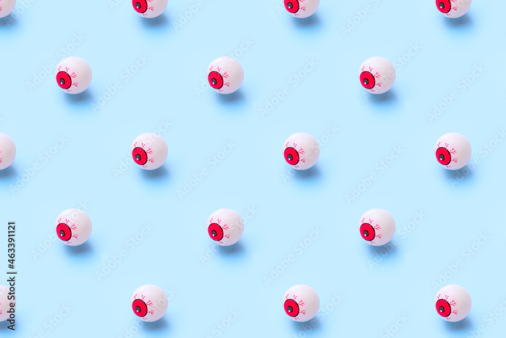 Halloween pattern of bloody eyeball on a blue background
Halloween pattern of bloody eyeball on a blue background