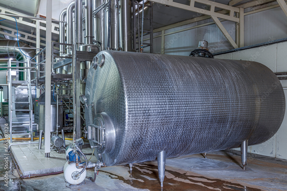 Technological equipment in modern dairy facilities.Production of dairy products. Plant, factory in operating mode. Automation of production, conveyors. Technological equipment in modern dairy facilities.Production of dairy products. Plant, factory in operating mode. Automation of production, conveyors.
