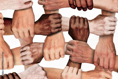 The clenched hands of working people of different nationalities with different skin colors. Social protest against injustice and racism. Black Lives Matter. photo