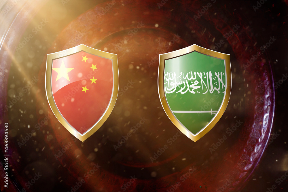 Fototapeta premium china and saudi Arabia flag in golden shield on copper texture background.