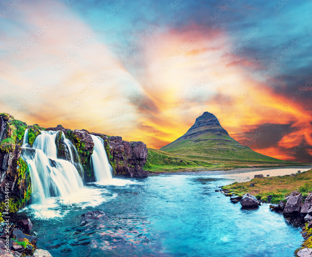 Beautiful natural magical scenery with a waterfall Kirkjufell near the volcano in Iceland. Exotic countries. Amazing places. Popular tourist atraction. (Meditation, antistress - concept).