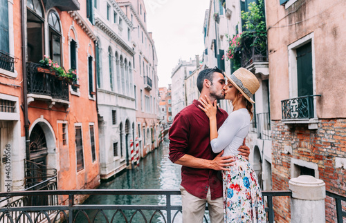 Couple of tourists having a romantic weekend in Venice - Boyfriend and girlfriend in love kissing on city street - Relationship and holidays concept