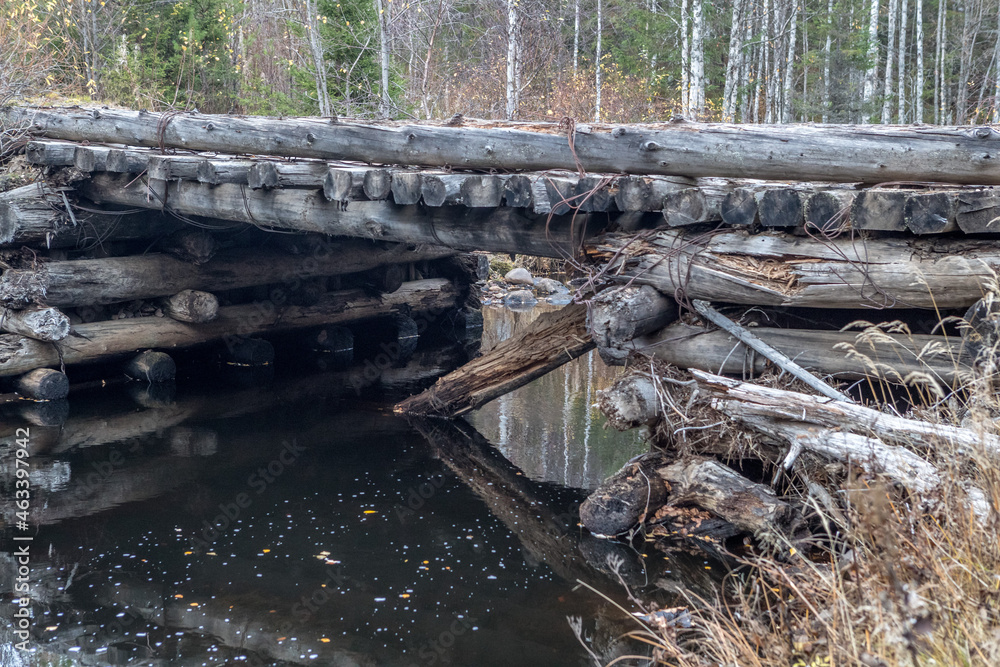 Old wooden bridge. Bridge on a forest road. Russian road. Old wooden bridge. Bridge on a forest road. Russian road.