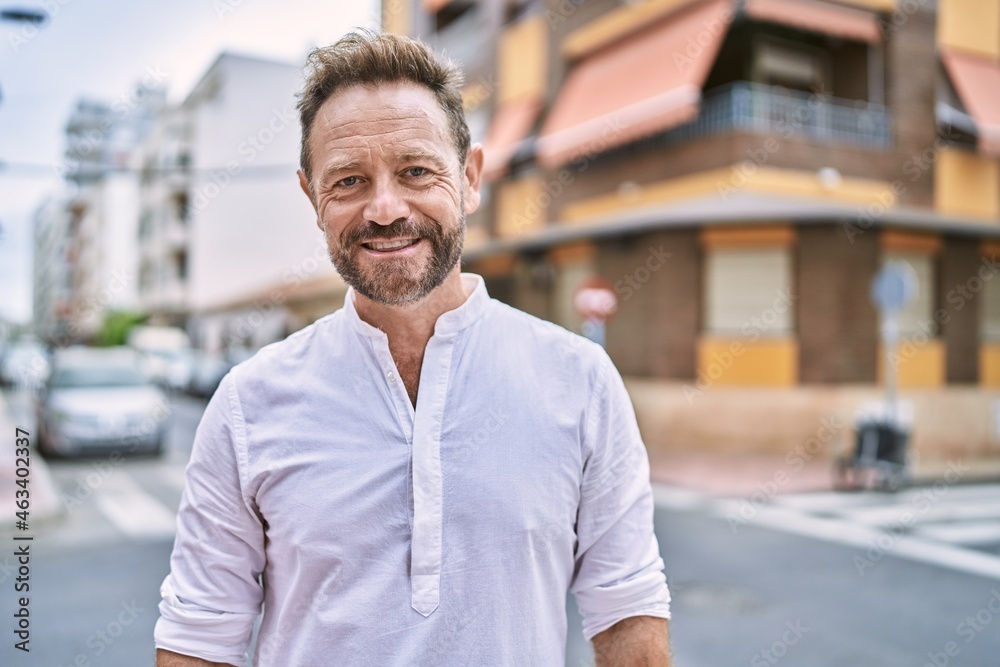 Fototapeta premium Middle age man smiling confident at the city