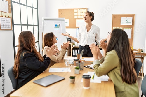 Group of young businesswomen smiling and clapping to partner at the office. © Krakenimages.com
