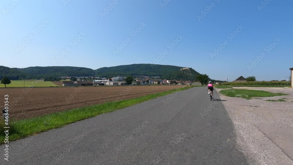 A girl rides a bicycle. Cycling outside the city A girl rides a bicycle. Cycling outside the city