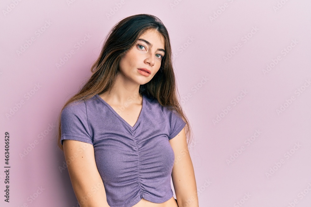 Young caucasian woman wearing casual clothes relaxed with serious expression on face. simple and natural looking at the camera.